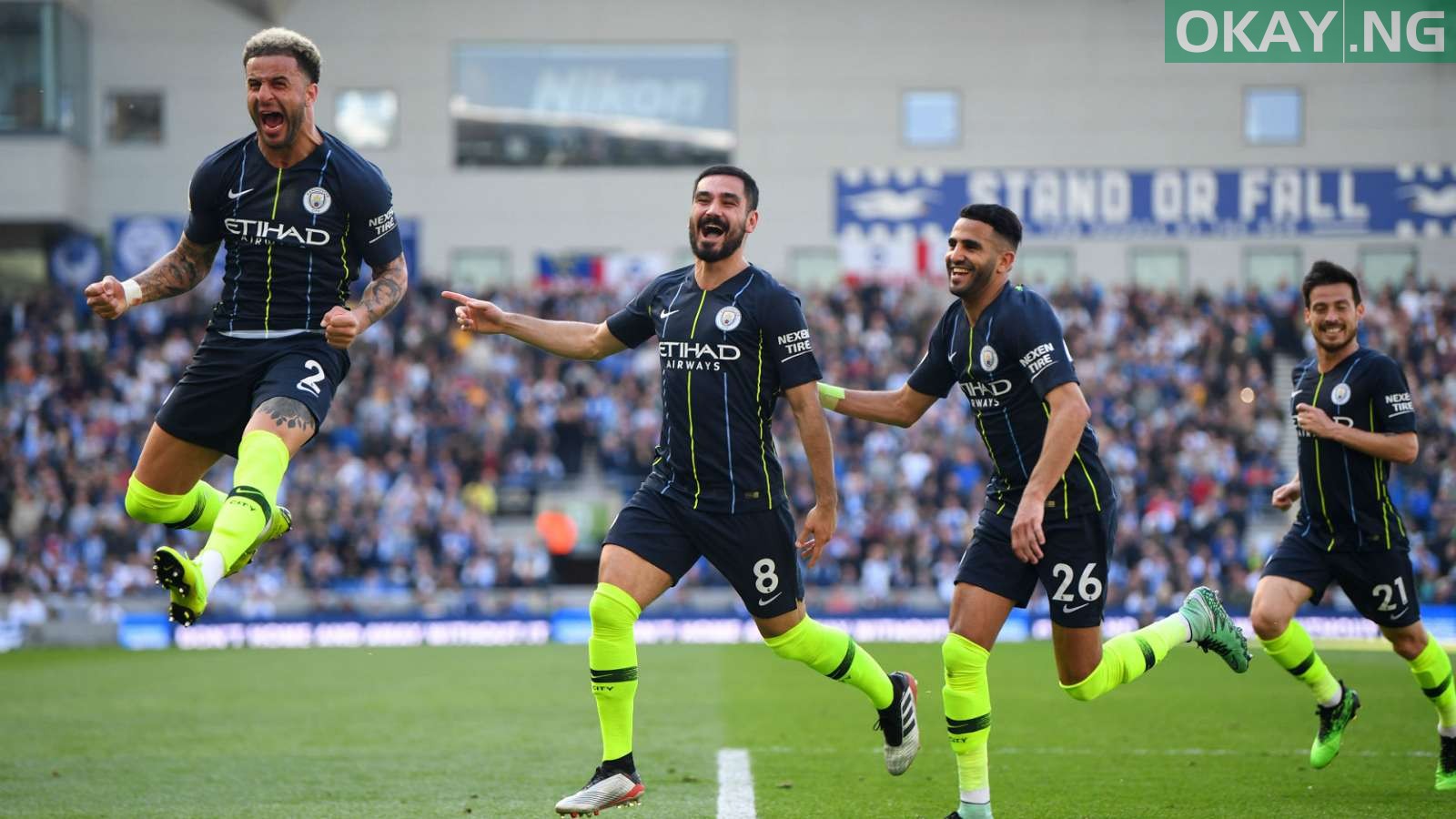 Manchester City players celebrating goals against Brighton and Hove Albion