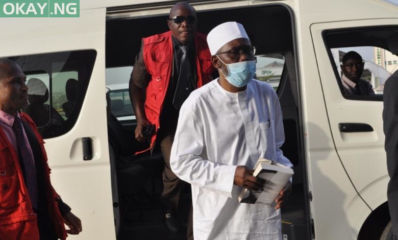 Mohammed Adoke with EFCC operatives