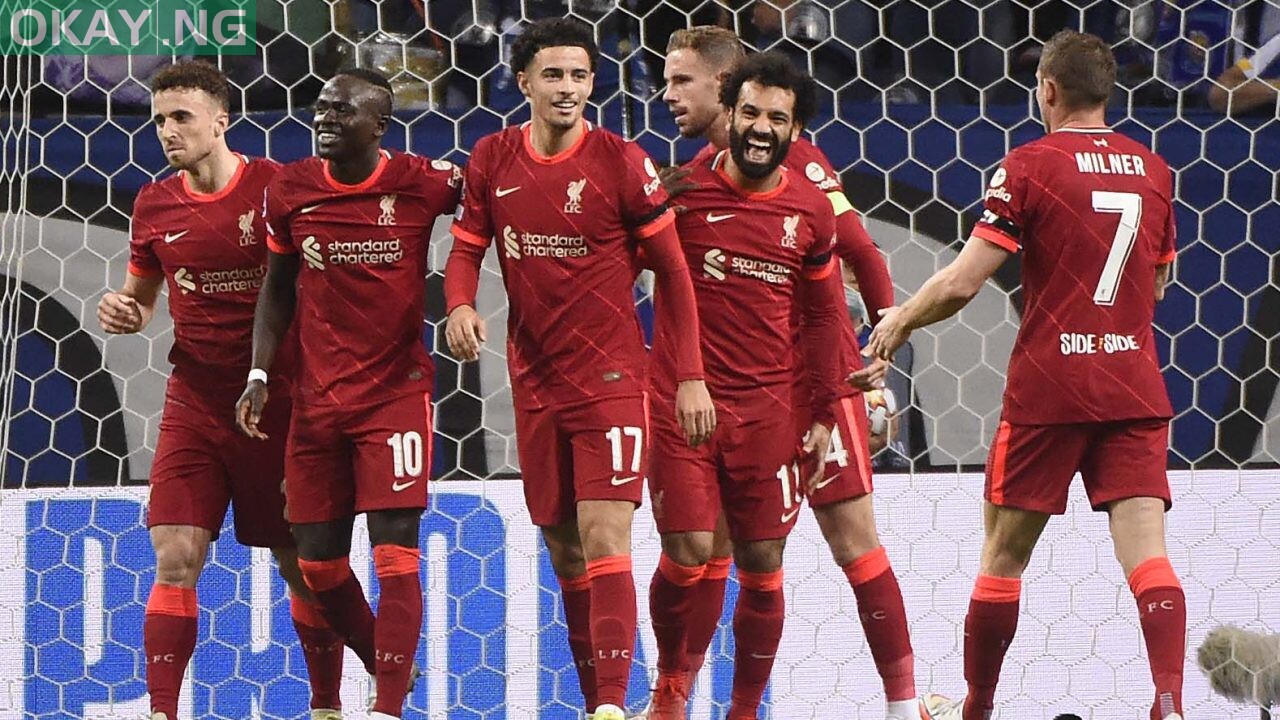 Liverpool’s Egyptian forward Mohamed Salah (2R) celebrates scoring the opening goal during the UEFA Champions League first round group B footbal match between Porto and Liverpool at the Dragao stadium in Porto on September 28, 2021.