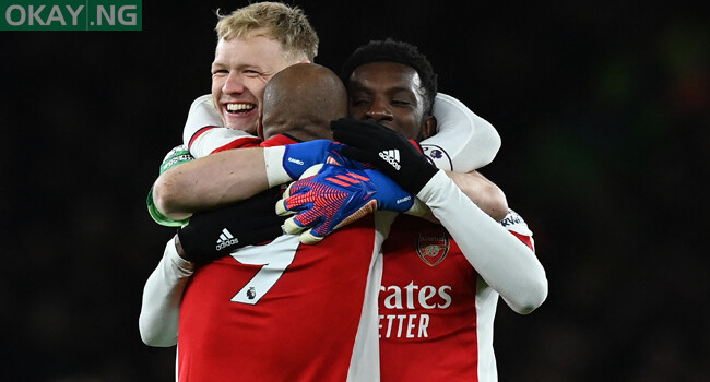 Arsenal’s French striker Alexandre Lacazette (C) celebrates with Arsenal’s English goalkeeper Aaron Ramsdale (L) and Arsenal’s English striker Eddie Nketiah (R) on the final whistle in the English Premier League football match between Arsenal and Wolverhampton Wanderers at the Emirates Stadium in London on February 24, 2022. Arsenal won the game 2-1. Glyn KIRK / AFP