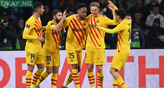 Barcelona’s Gabonese midfielder Pierre-Emerick Aubameyang (C) celebrates with teammates after scoring his team’s fourth goal during the UEFA Europa League knockout round play-off second leg football match between SSC Napoli and FC Barcelona at the Diego Armando Maradona Stadium in Naples on February 24, 2022. ANDREAS SOLARO / AFP