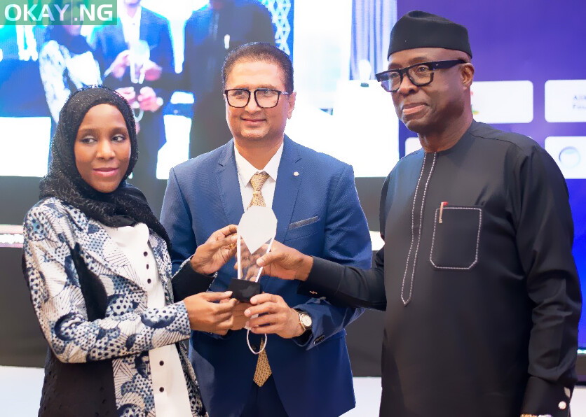 Minister of Trade and Investment, Otunba Niyi Adebayo (left) presenting the award to the Group Executive Director, Commercial Operations, Dangote Industries Limited, Halima Aliko-Dangote (left) and the Group Managing Director, Dangote Sugar Refinery Plc, Ravindra Singhvi (middle)