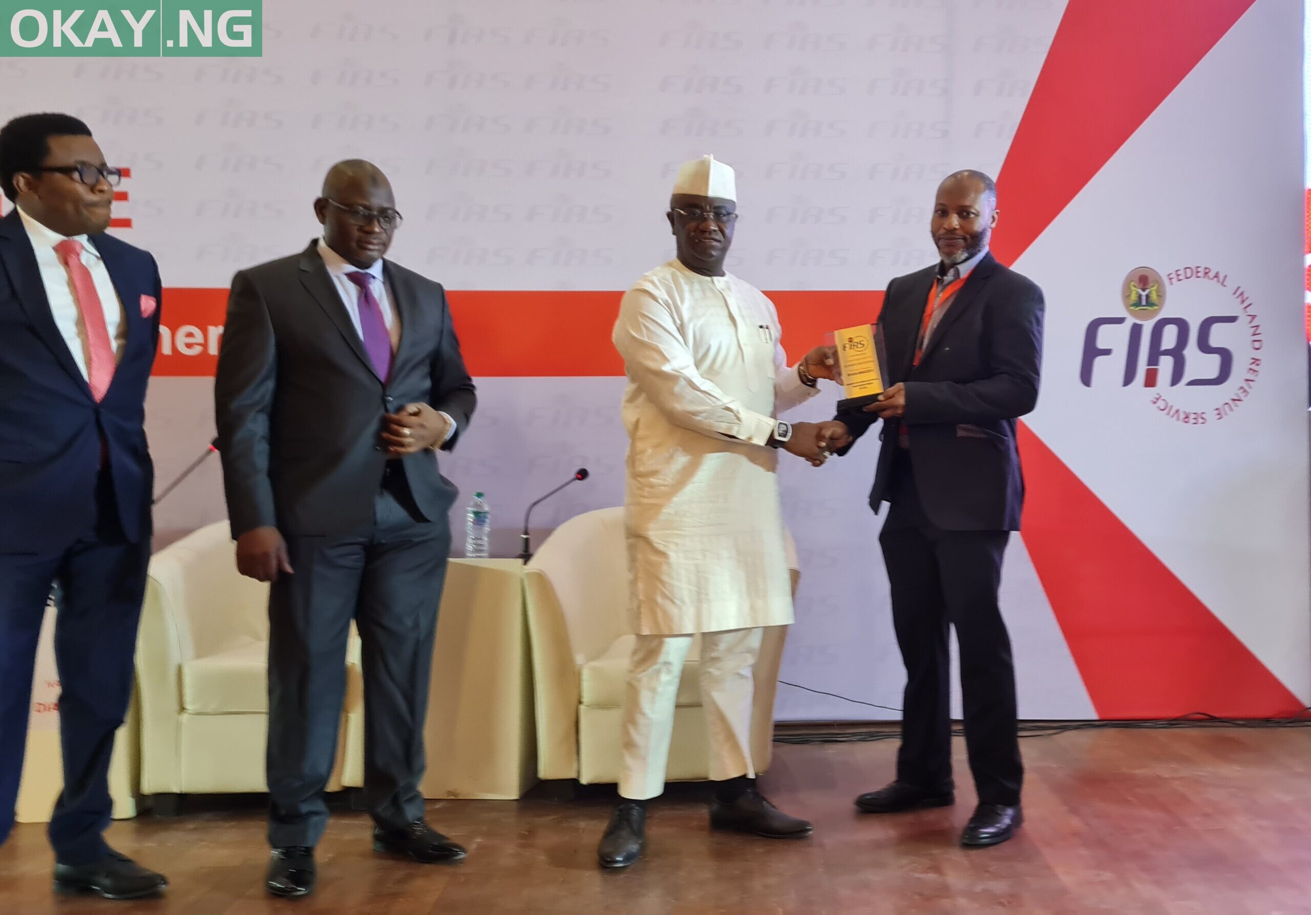 L-R: 3. Hon. Chike Okafor, representing the House Committee Chairman on Finance; Chairman FIRS, Muhammad Nami, and Prince Clement Agba Minister of State Budget and National Planning presenting the Awards to Modupe Kadri, Chief Financial Officer, MTN Nigeria at National Tax Dialogue Event held at the Banquet Hall, State House Presidential Villa Abuja on Tuesday, March 29, 2022.