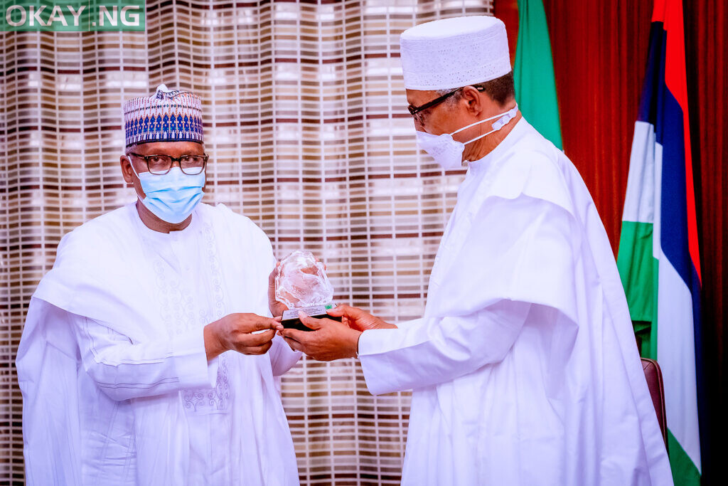 President of Dangote Group, Aliko Dangote, presenting a gift to President Muhammadu Buhari, during a courtesy visit by the Management and Board of Dangote Industries Limited (DIL), to the Presidential Villa, in Abuja on Friday