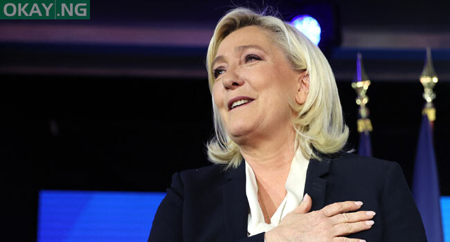 French far-right party Rassemblement National (RN) presidential candidate Marine Le Pen reacts at the Pavillon d’Armenonville in Paris on April 24, 2022 after the announcement of the first projections by polling firms of the French presidential election’s second round results. Thomas SAMSON / AFP