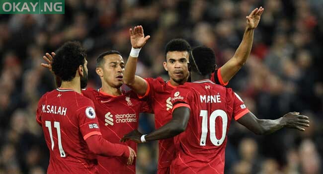 Liverpool’s Senegalese striker Sadio Mane celebrates with teammates after scoring his team third goal during the English Premier League football match between Liverpool and Manchester United at Anfield in Liverpool, northwest England on April 19, 2022. Oli SCARFF / AFP
