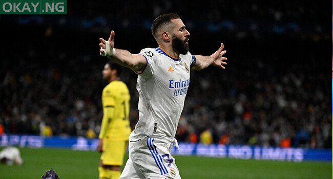 Real Madrid’s French forward Karim Benzema celebrates after scoring a goal during the UEFA Champions League quarter final second leg football match between Real Madrid CF and Chelsea FC at the Santiago Bernabeu stadium in Madrid on April 12, 2022. PIERRE-PHILIPPE MARCOU / AFP