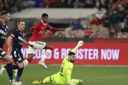 Marcus Rashford (C) of Manchester United scores a goal during the exhibition football match between English Premier League team Manchester United and Melbourne Victory at the Melbourne Cricket Ground on July 15, 2022, in Melbourne. (Photo by Martin KEEP / AFP)