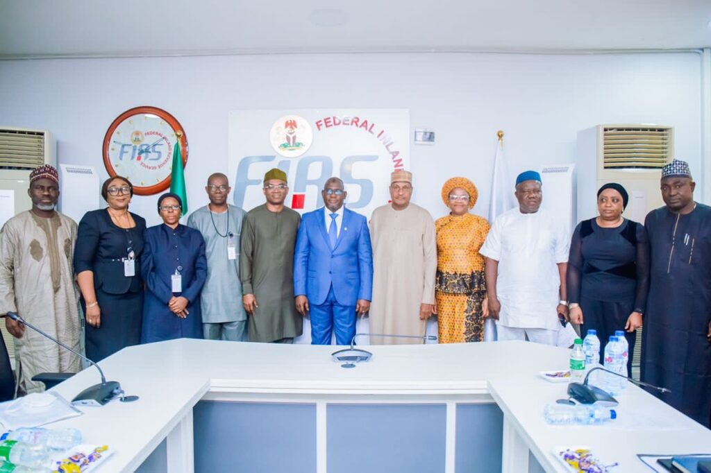 (L-R) Munkaila Abimbola, Deputy Director, Large Tax Audit Downstream, FIRS; Nneka Ifekwena, Board Secretary, FIRS; Hajia Amina Ado, Director, Special and Emerging Taxes Department, FIRS; Mr. Mathew Gbonjubola, Group Lead, Special Tax Group, FIRS; Mr. Olalekan Ogunleye, Deputy Managing Director, NLNG; Muhammad Nami, Executive Chairman, FIRS; Muhammad Ahmed, Group Lead, General Services Group, FIRS; Mrs Chiaka Ben-Obi, Group Lead, Digital Innovation Support Group, FIRS; Mr. Iro Ukpai, Director, Technical Department, FIRS; Hajia Aisha Muhammad, Director, office of the Executive Chairman, FIRS; Dr. Abdullahi Ismaila Ahmed, Director, Communications and Liaison Department, FIRS, at the ceremony to handover the Tax Credit Certificate for the construction of the Bonny - Bodo Road and Bridge, Rivers State, to NLNG. 18th August 2022.