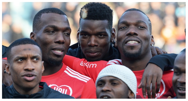In this file photo taken on December 29, 2019, the Pogba brothers, Manchester United and France midfielder Paul Pogba (C), Atlanta United defender Florentin Pogba (L), and CD Manchego midfielder Mathias Pogba (R), pose prior to a gala football match between All-Star France and Guinea at the Vallee du Cher Stadium in Tours, central France, as part of the “48h for Guinea” charity event. Photo by GUILLAUME SOUVANT / AFP)