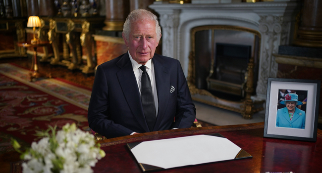 Britain’s King Charles III makes a televised address to the Nation and the Commonwealth from the Blue Drawing Room at Buckingham Palace in London on September 9, 2022, a day after Queen Elizabeth II died at the age of 96. (Photo by Yui Mok / POOL / AFP)