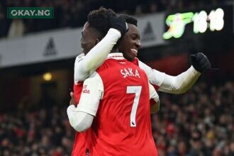 Eddie Nketiah (L) and Bukayo Saka (R) of Arsenal celebrate Nketiah's game-winning goal during the Premier League match against Manchester United at the Emirates Stadium on January 22, 2023. (Photo by Glyn KIRK / AFP)